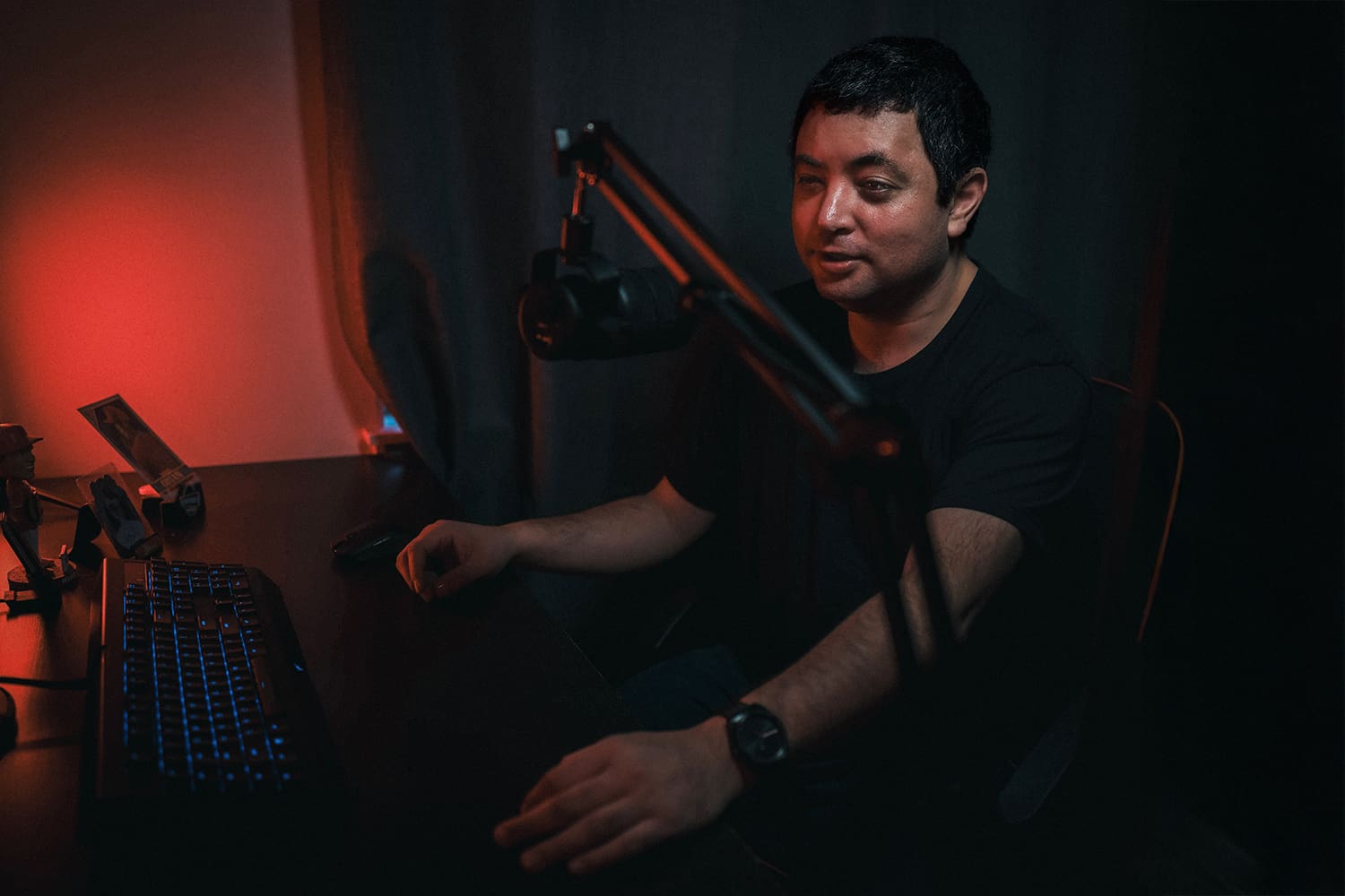 Randy Nuñez speaking into the mic on the Between the Chalk Lines baseball podcast with an overlay of his Ad Armory website